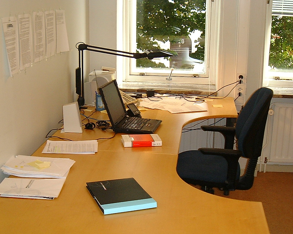 office setup with files and papers on a desk
